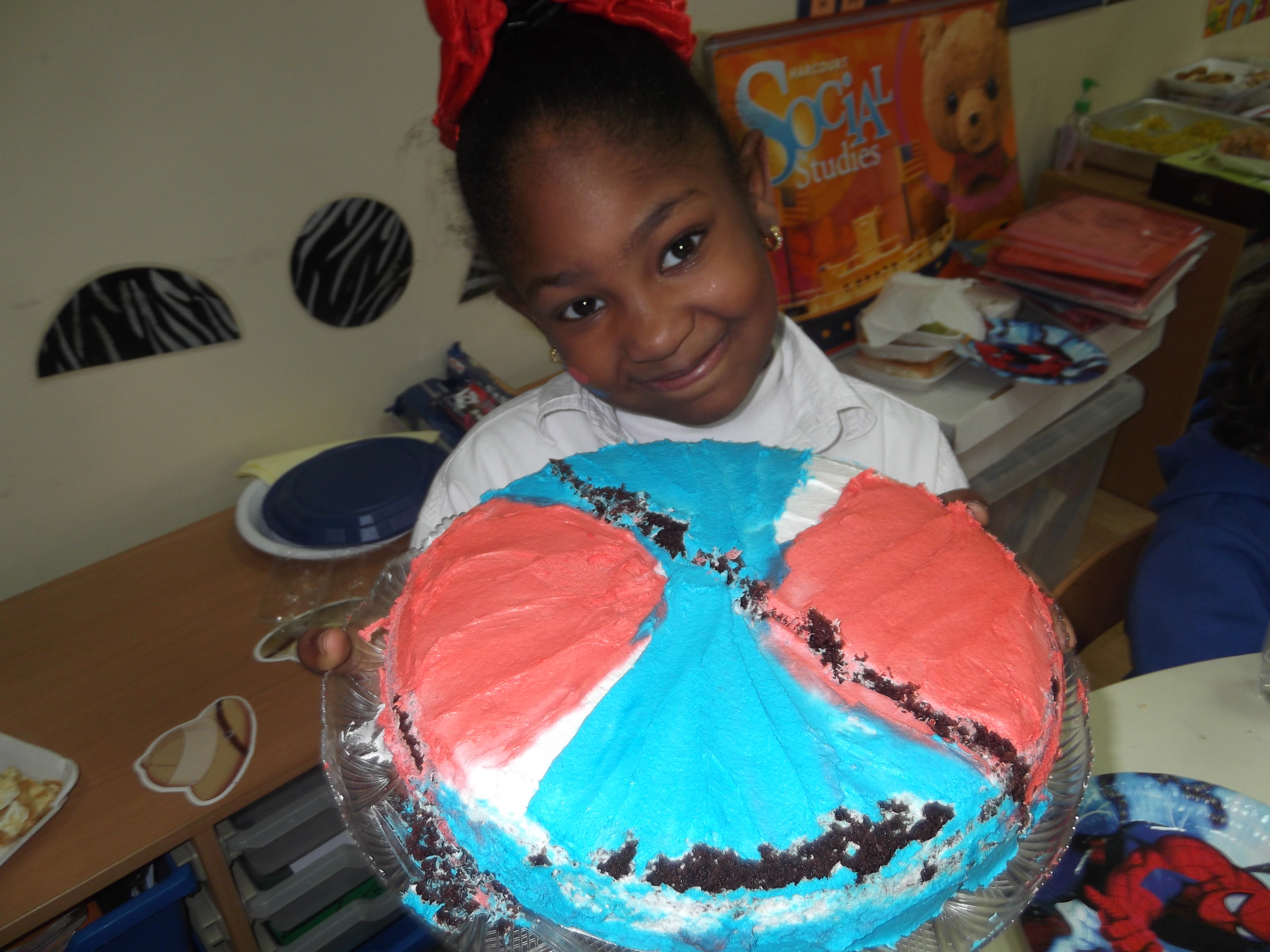 She was so excited to cut pieces of cake for her friends.