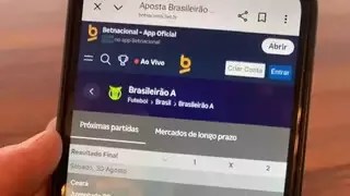 Celular exibe página inicial de plataforma de apostas esportivas; Lula anuncia fim das bets com prisão para operadores ilegais.