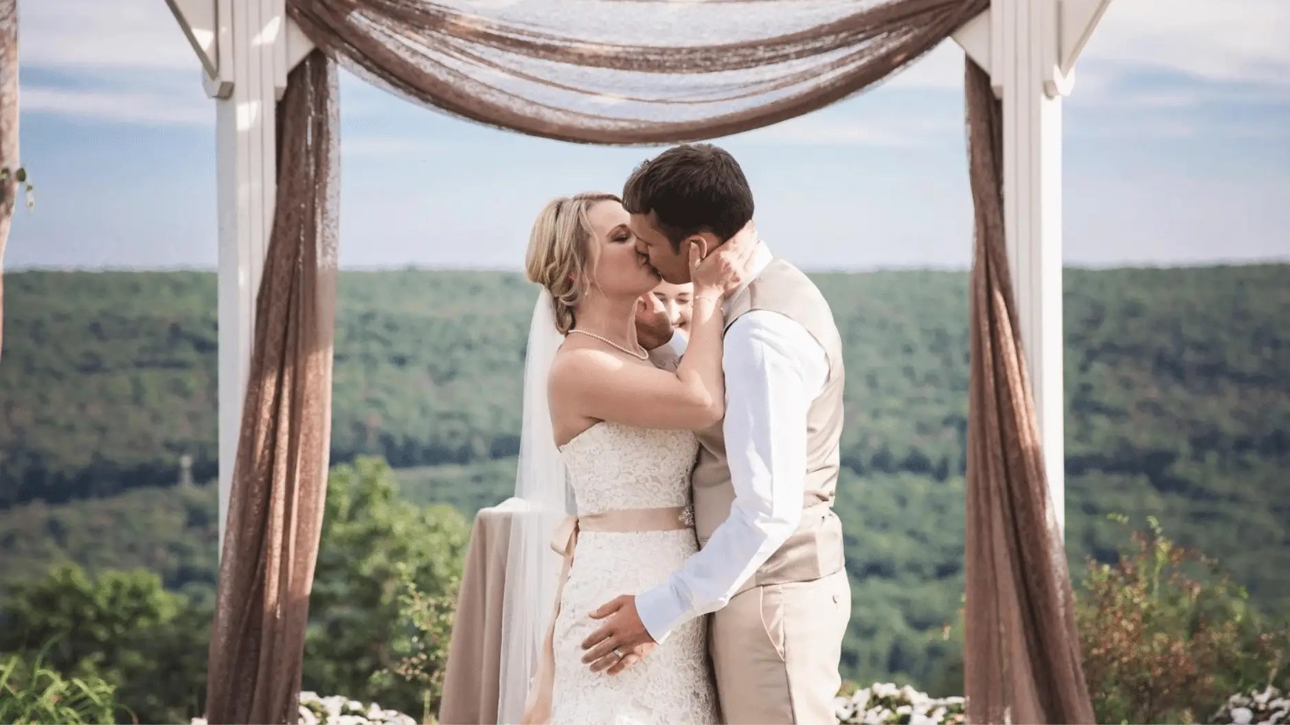 a wedding couple first kiss