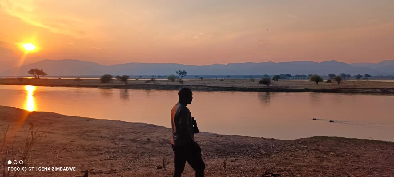 Muchie beside the Zambezi River at sunset.