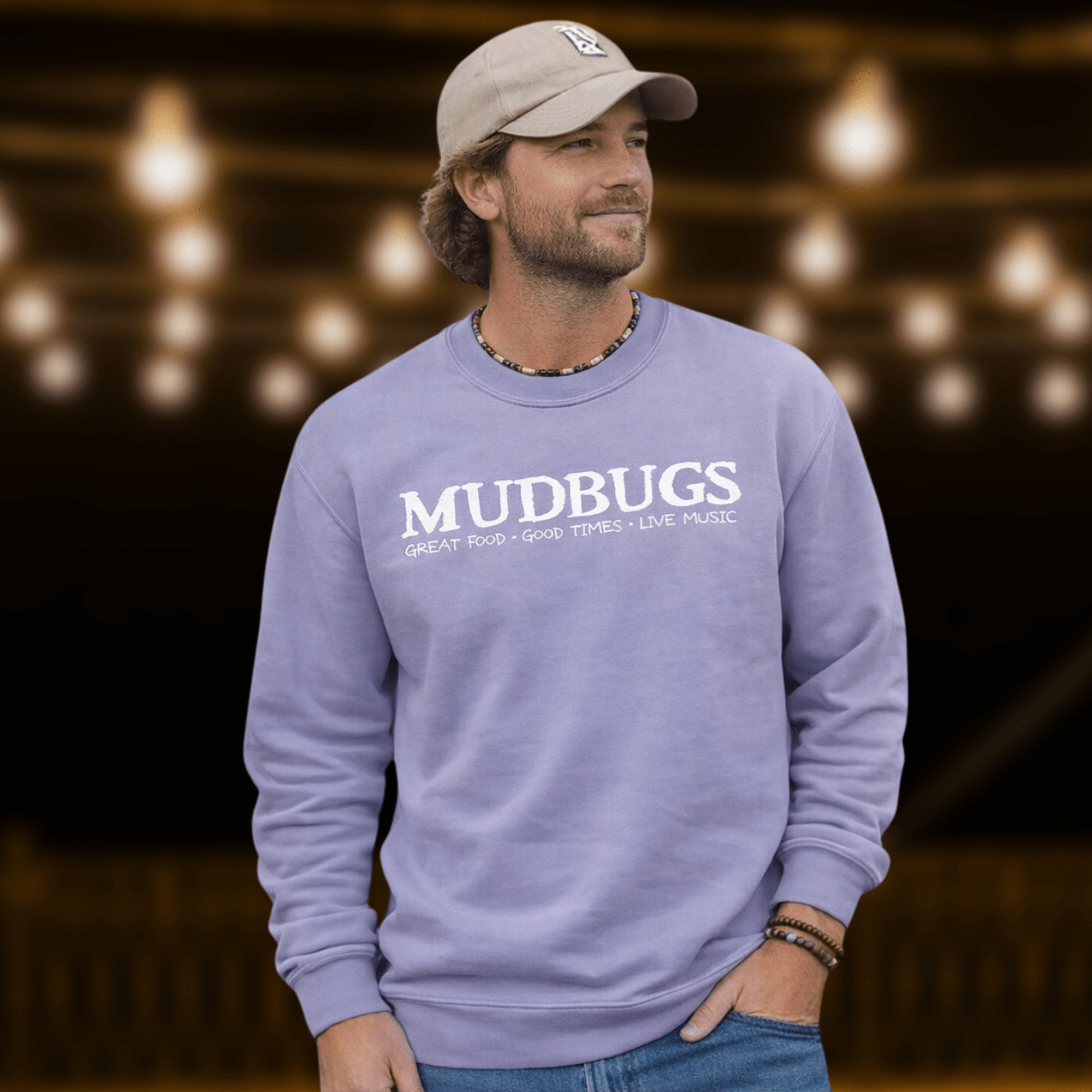 Man wearing Mudbugs Comfort Colors orchid crewneck sweatshirt with white logo