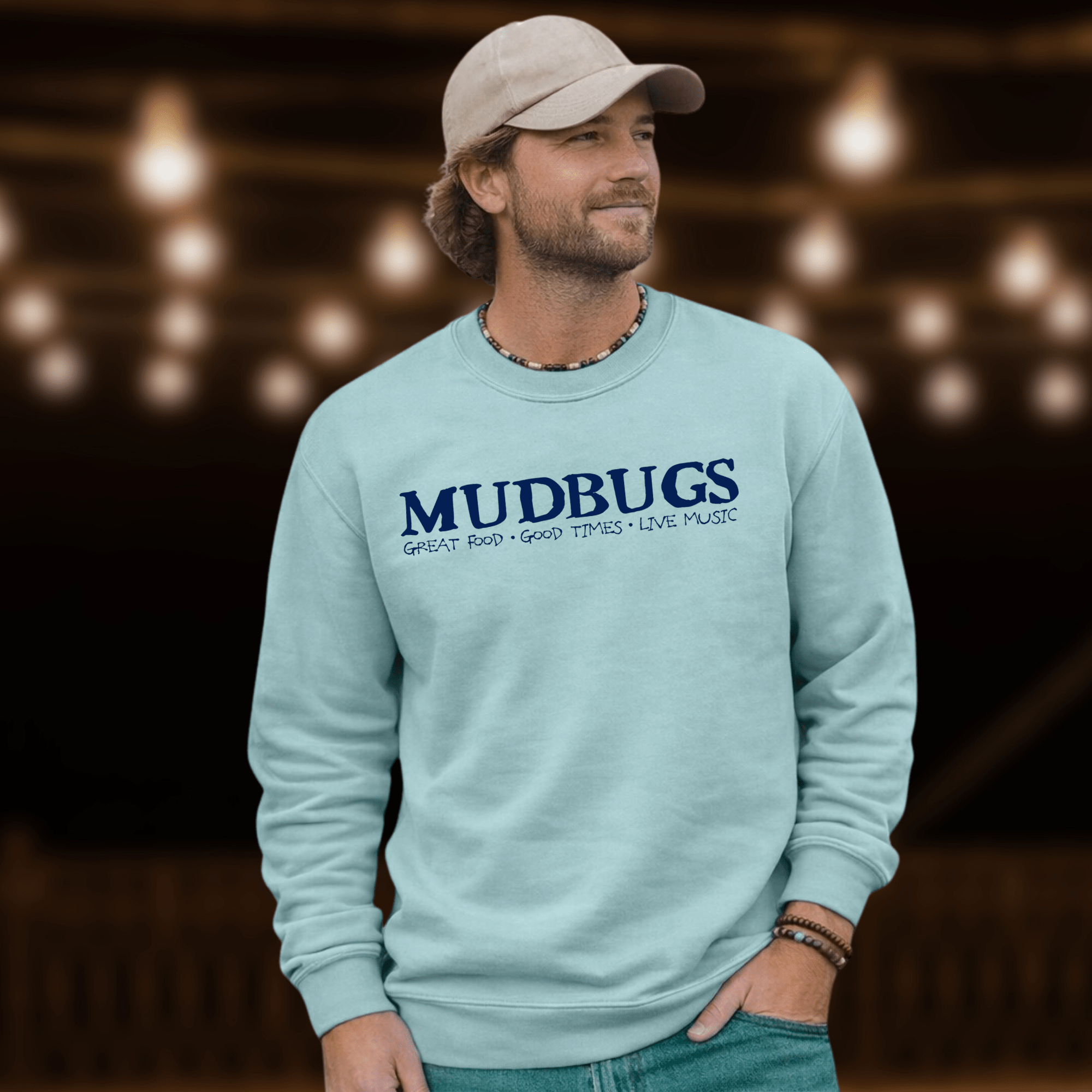 Man wearing Mudbugs Comfort Colors chambray crewneck sweatshirt with navy logo