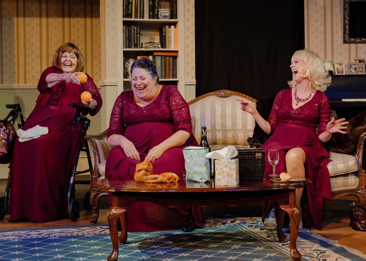 three actresses and friends in The Cemetery Club laugh