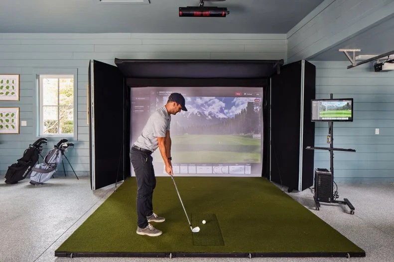 Murphy retractable simulator in a residential garage