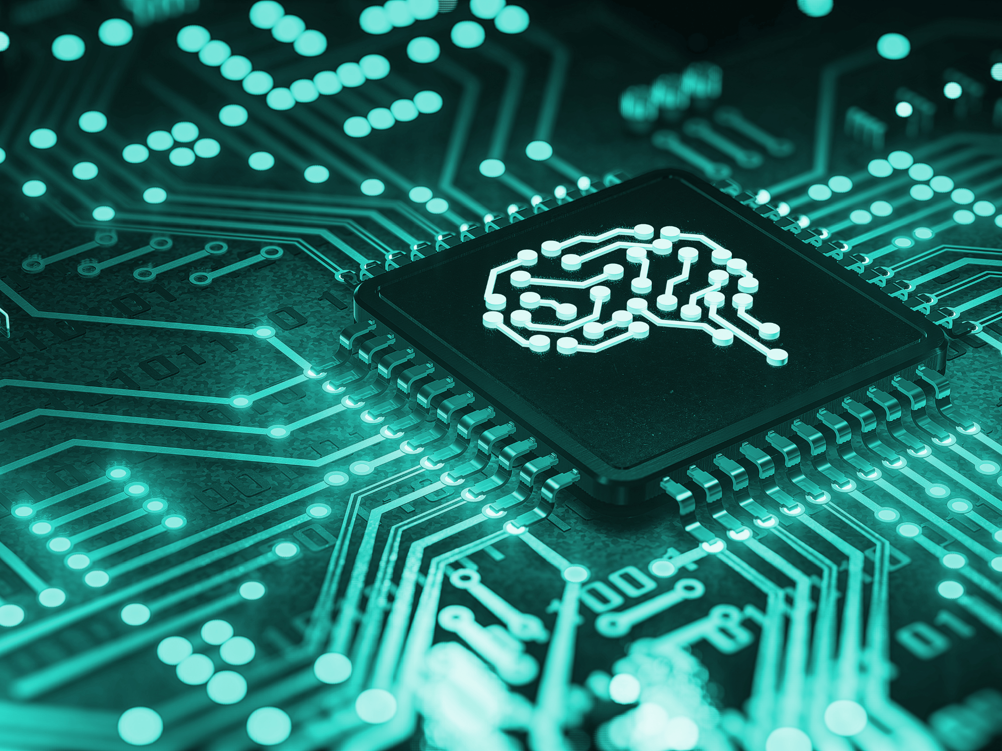 computer circuit board showing a chip with a human brain pattern on it