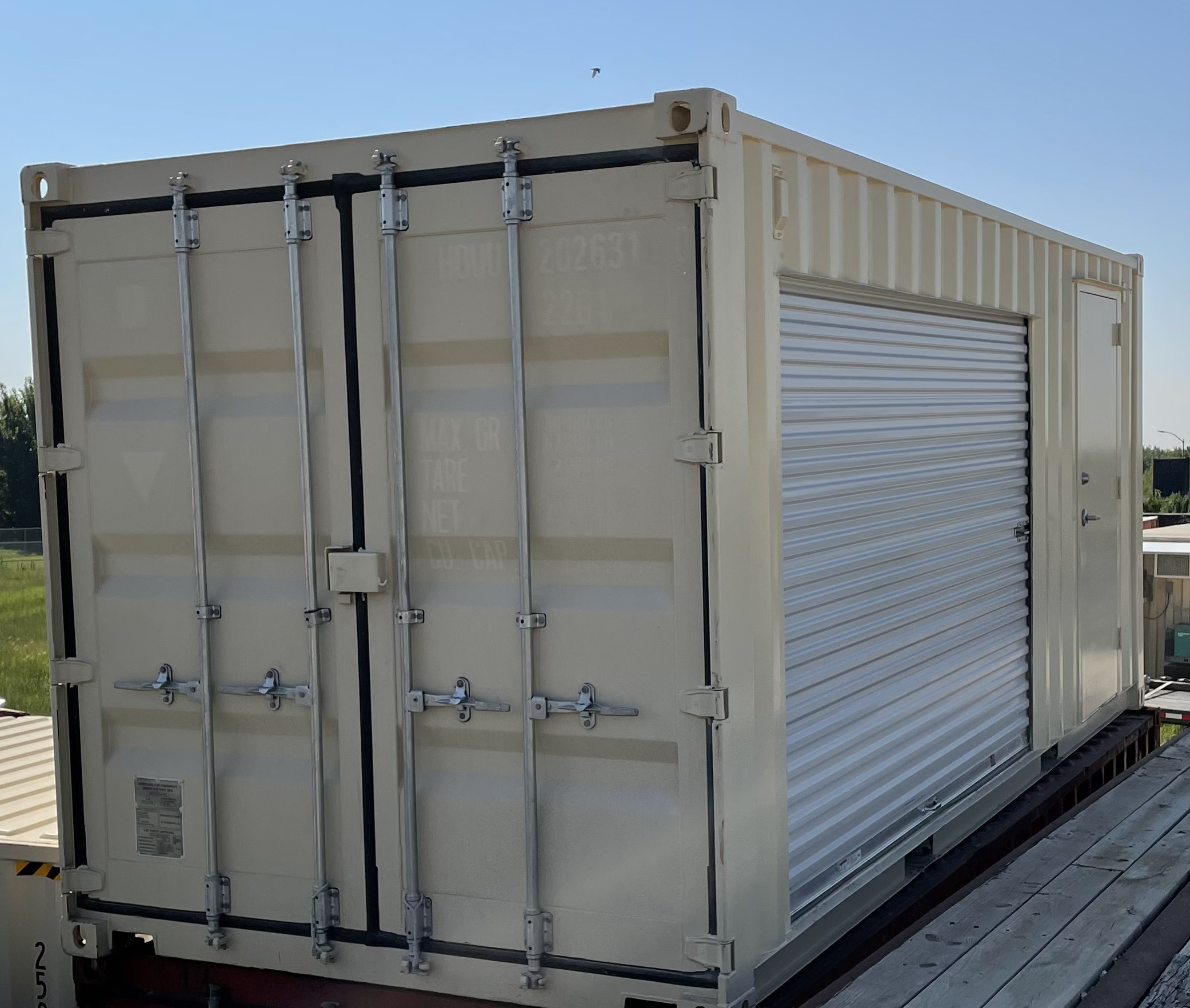 Shipping container with side roll up door