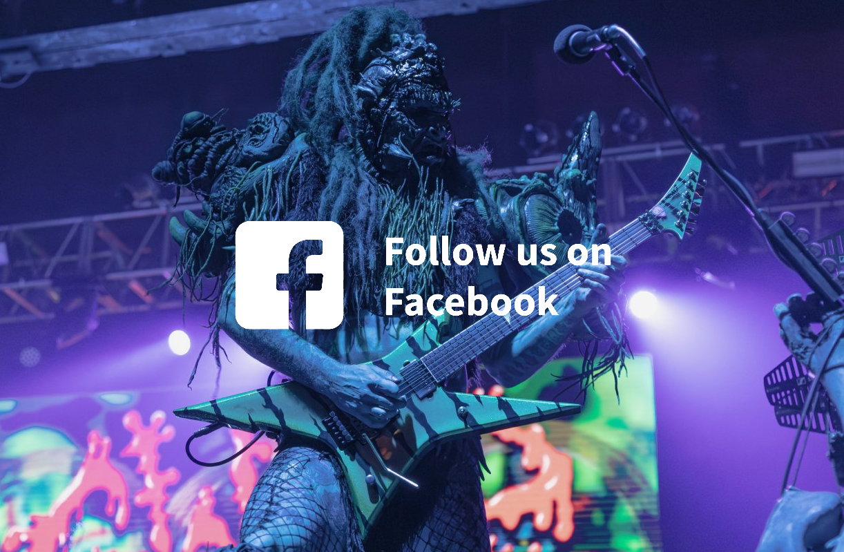 Guitarist in a monster costume performs on stage with a prominent Facebook logo and the text 'Follow us on Facebook'.