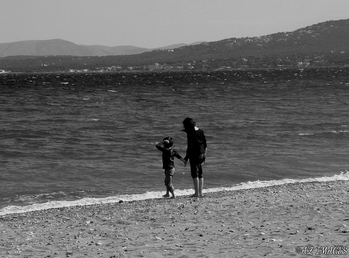 Children Standing on the Shore