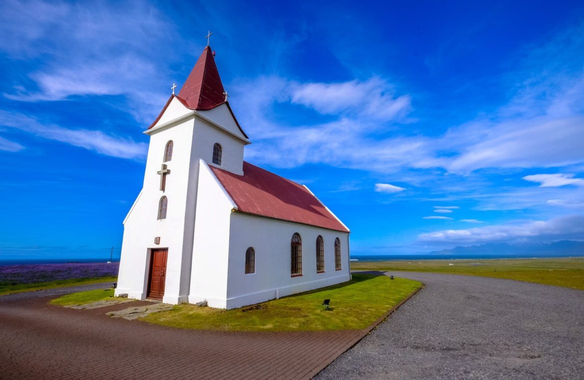 white cathedral under blue sky