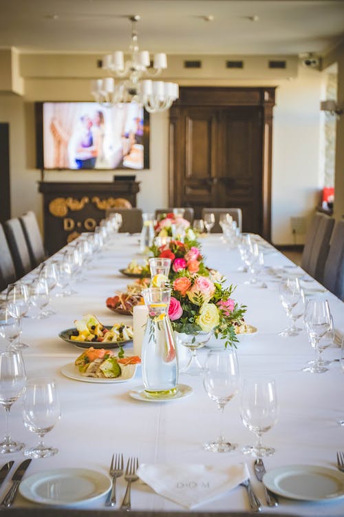 A dining table with wine glasses
