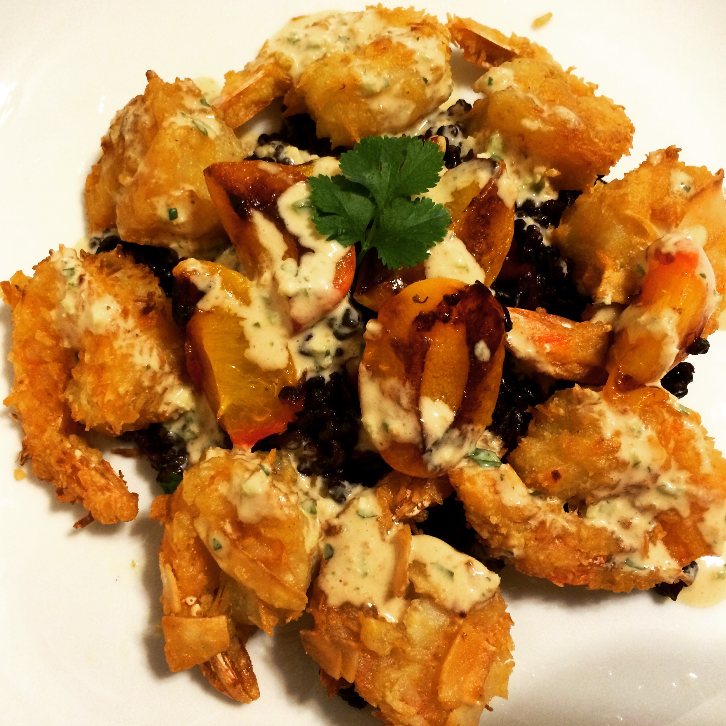 Coconut shrimp with grilled apricots and peanut coconut jalapeno drizzle