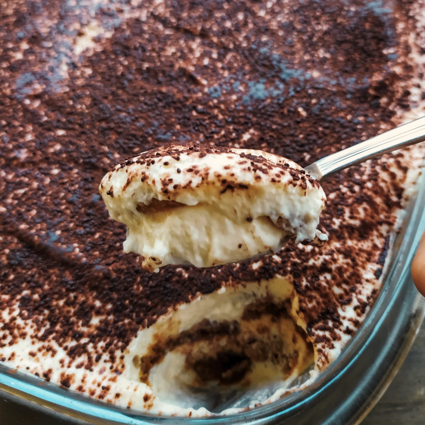 close up spoon with tiramisu