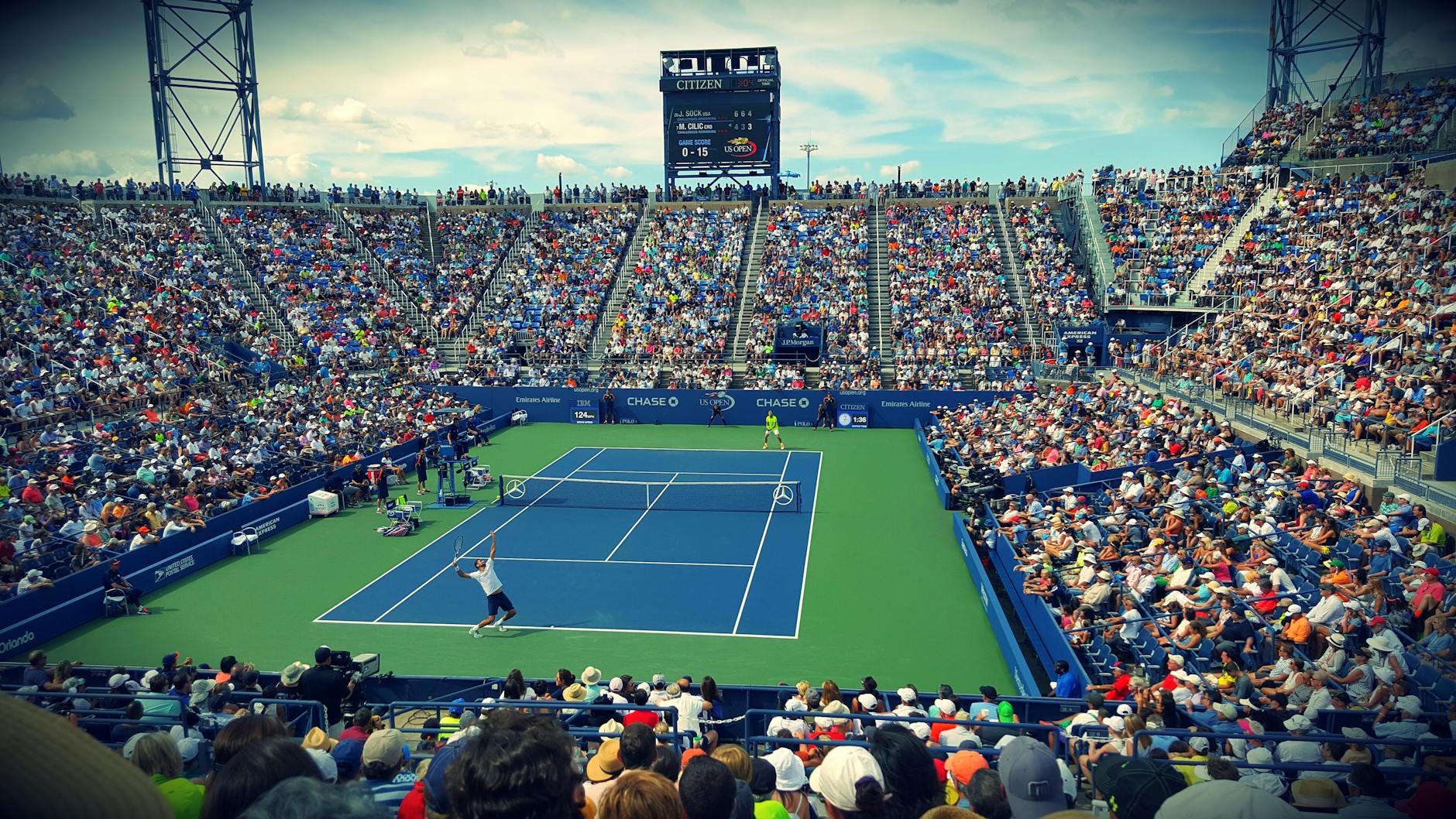 pexels-photo-171568 people sitting on bench watching tennis event on field during daytime
