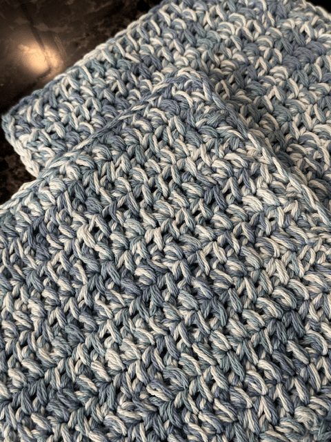 Beginner-friendly crochet hot pad in a solid cotton yarn color.