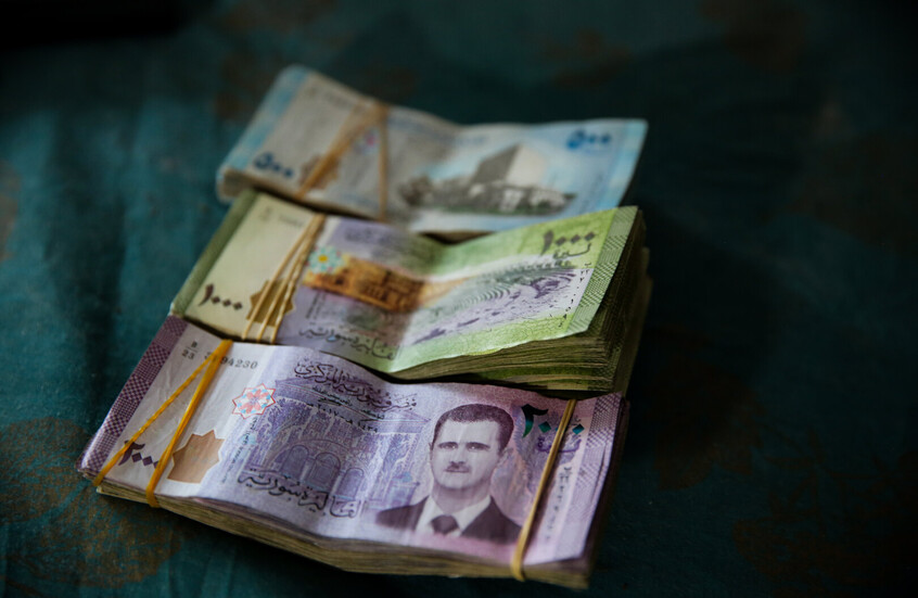 وزير الاقتصاد السوري السابق يحدد النقاط الإيجابية لتبديل العملة