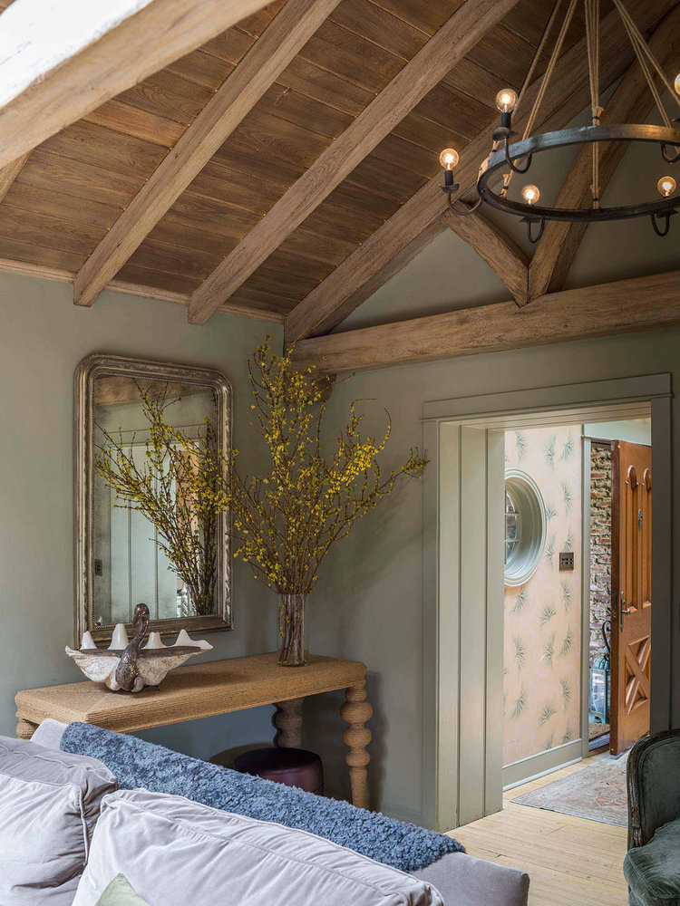 Green living room with wood ceiling. Design by Reath Design. Analogous color scheme