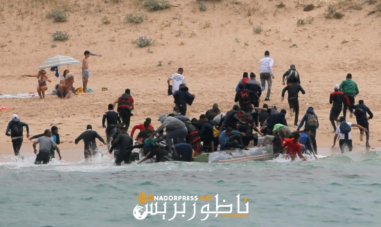 Migrants disembark from a dinghy at "Del Canuelo" beach after they crossed the Strait of Gibraltar sailing from the coast of Morocco, in Tarifa, southern Spain, July 27, 2018. REUTERS/Jon Nazca