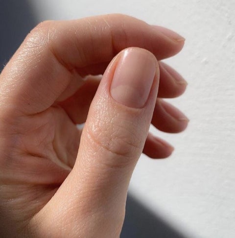 Hand with natural Japanese manicure