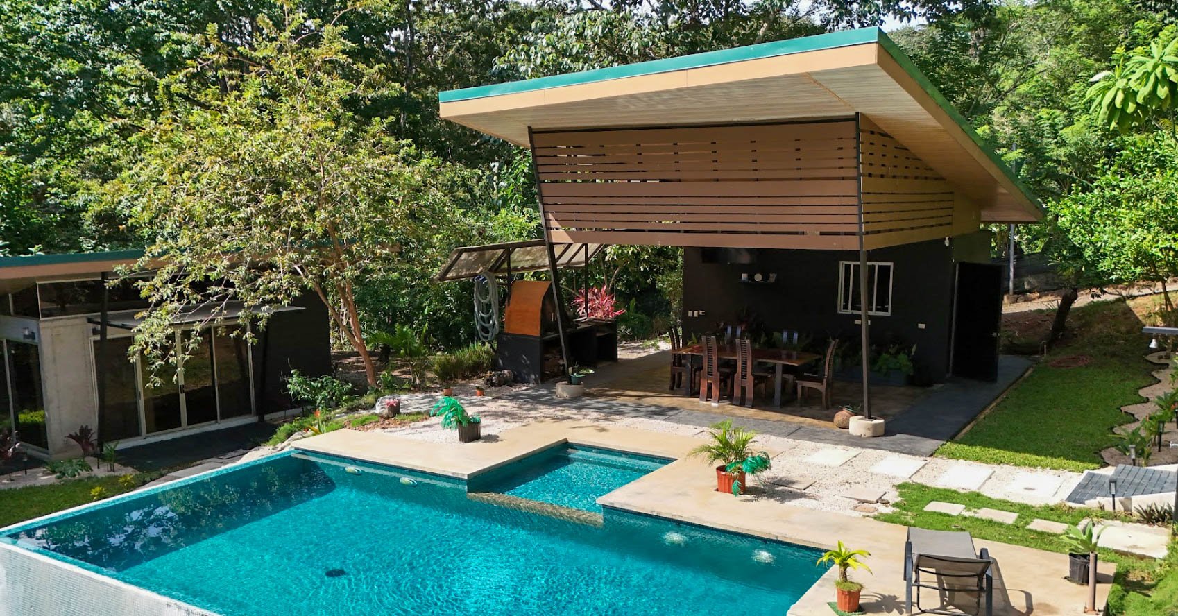 Ecolung's two-level infinity pool in front of the covered social area and shared kitchen
