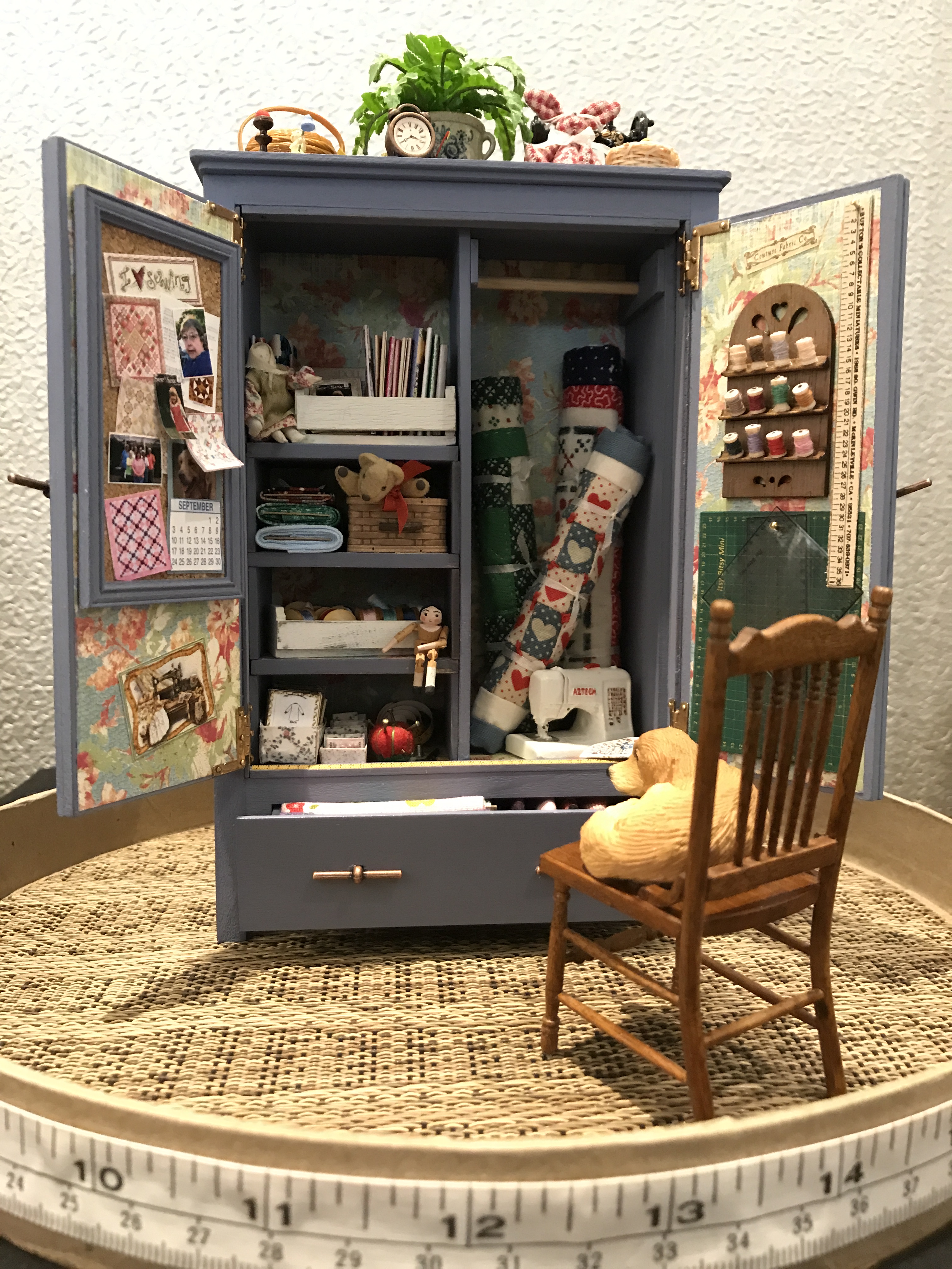 Barbara Adams's 1:12 scale cupboard is full of sewing notions.