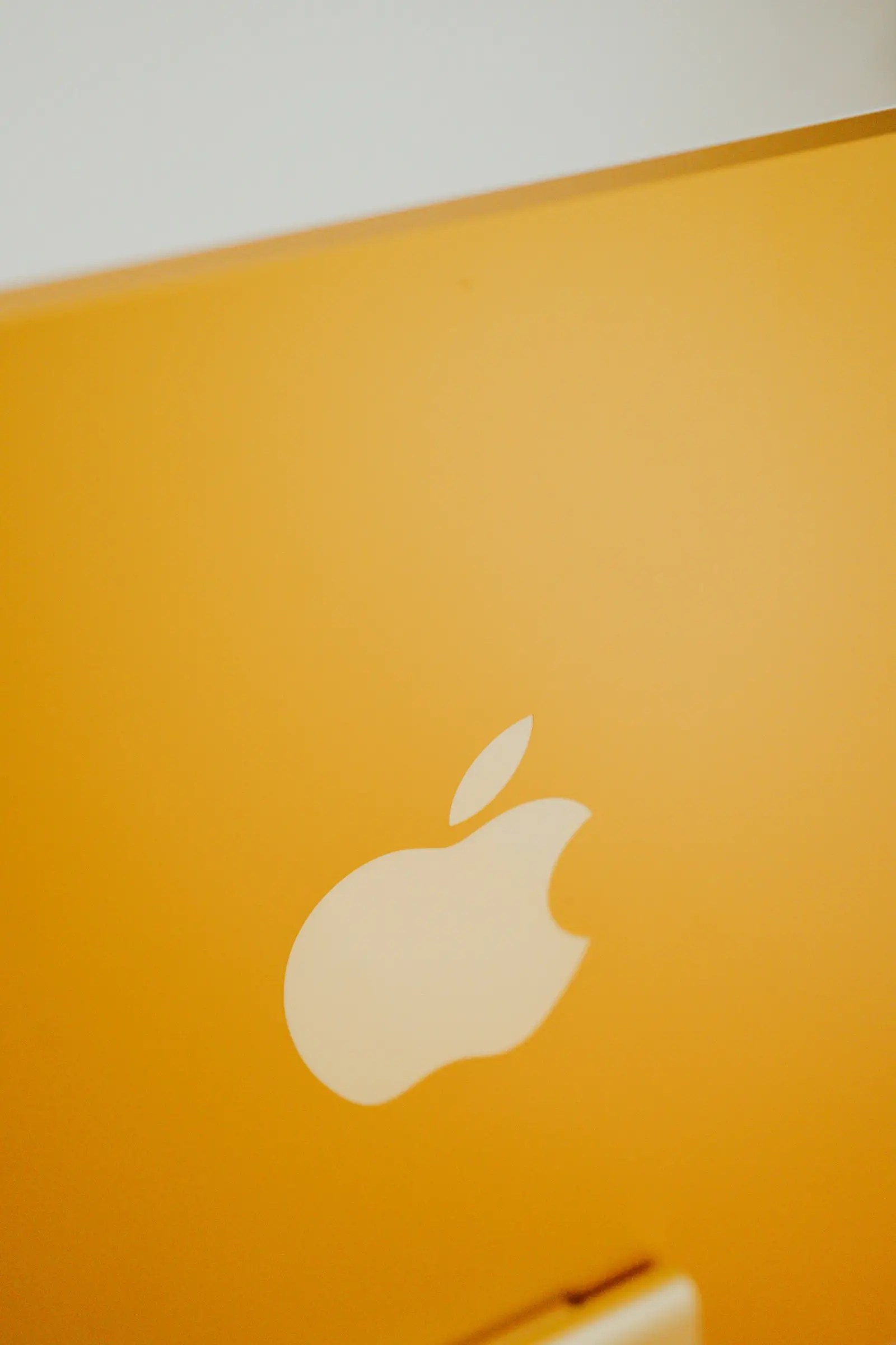 Apple MacBook on wooden table