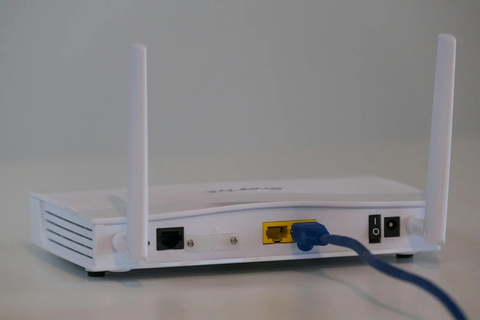 White WiFi router on table