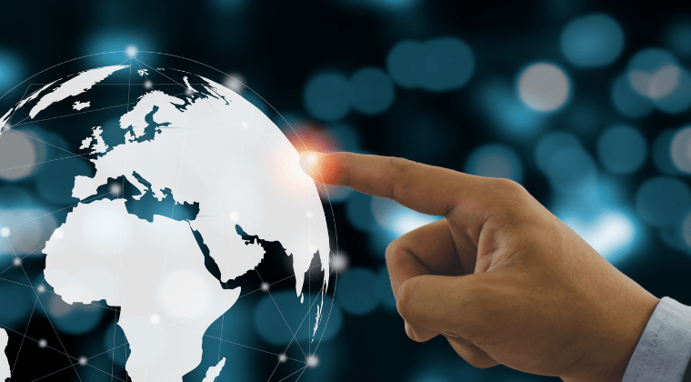 A hand reaching out to touch a glowing point on a digital globe, representing Naspeling®'s CPDSO-Accredited Economic Insight Online Course.
