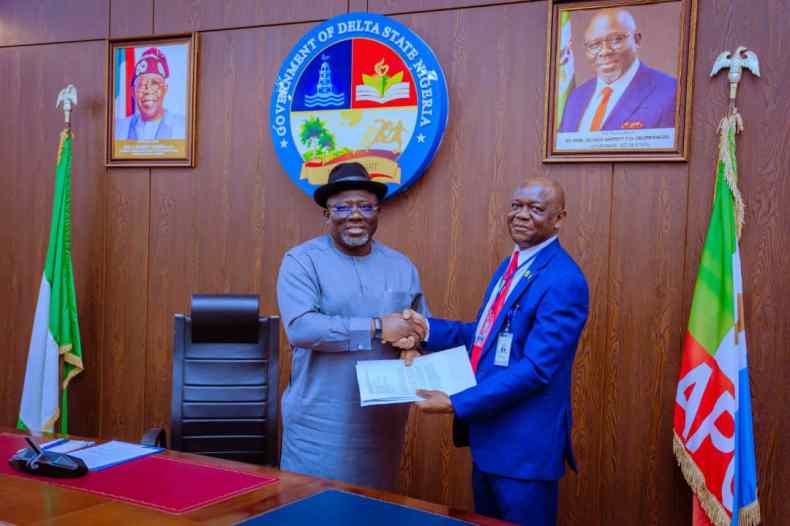 Delta State Governor, Rt. Hon. Sheriff Oborevwori (left) receives a document from Dr. Samuel Onoji, Principal of the Petroleum Training Institute (PTI), Effurun, during a courtesy visit to Government House, Asaba.
