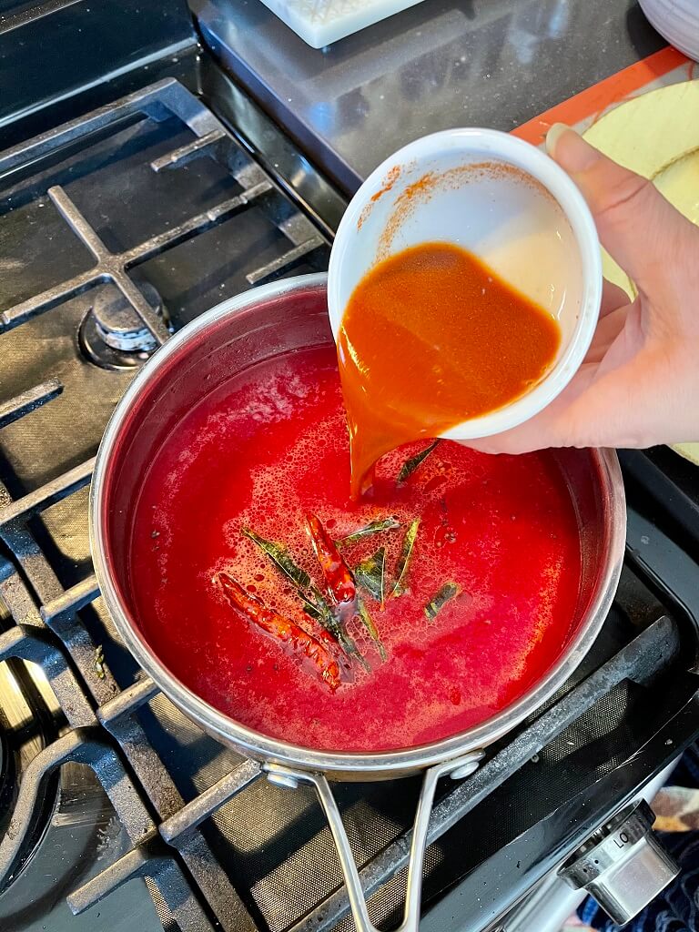 Tomato Beetroot Rasam with Coconut Rice - topped off with crunchy peanuts, fresh onions, crispy garlic and spicy namkeen to provide a burst of amazing flavors that take this traditional south indian soup to the next level!