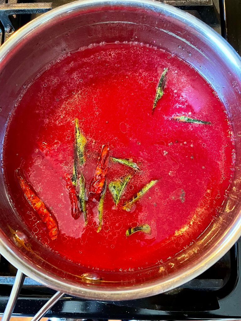 Tomato Beetroot Rasam with Coconut Rice - topped off with crunchy peanuts, fresh onions, crispy garlic and spicy namkeen to provide a burst of amazing flavors that take this traditional south indian soup to the next level!