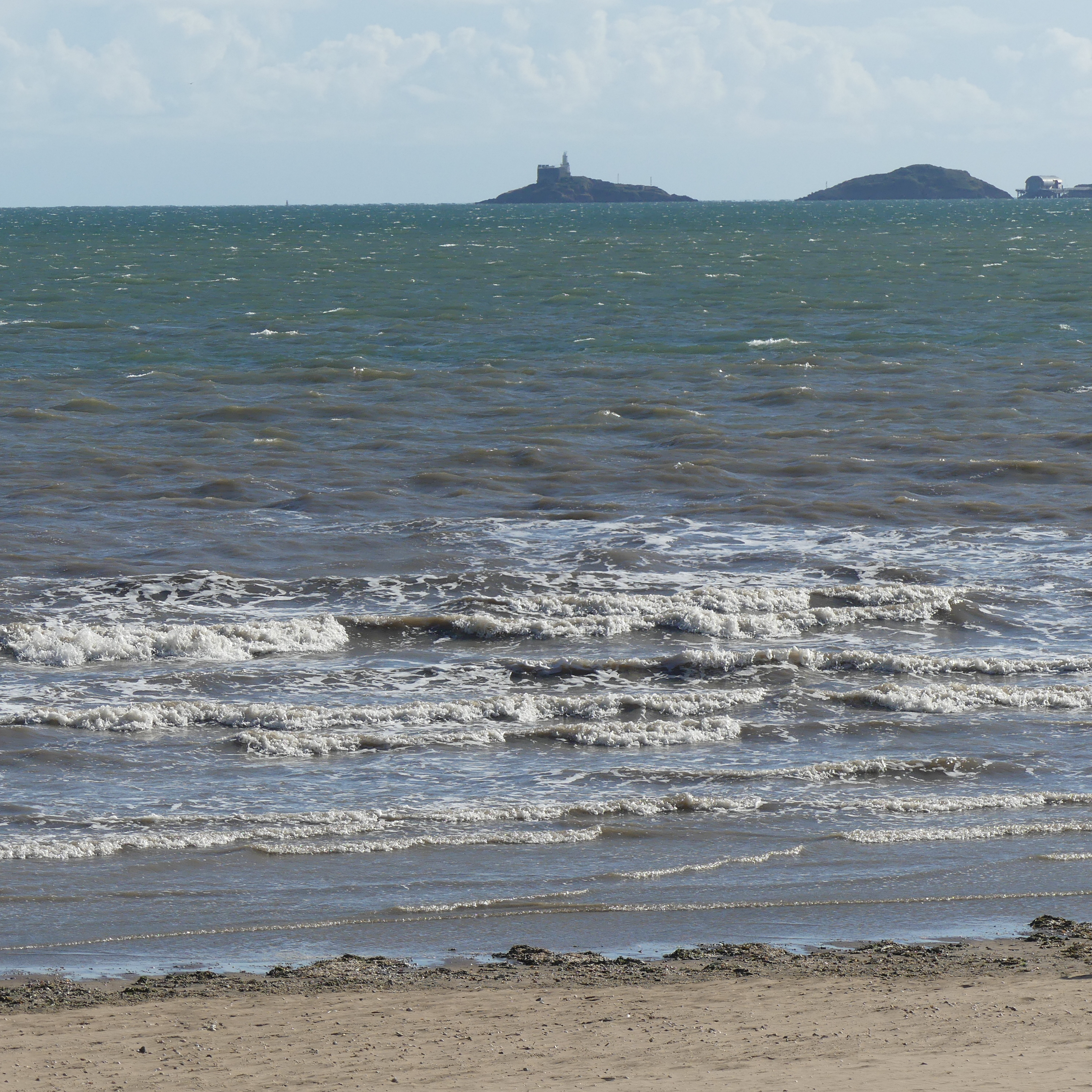 Waves at Swansea Bay with Mumbles in background