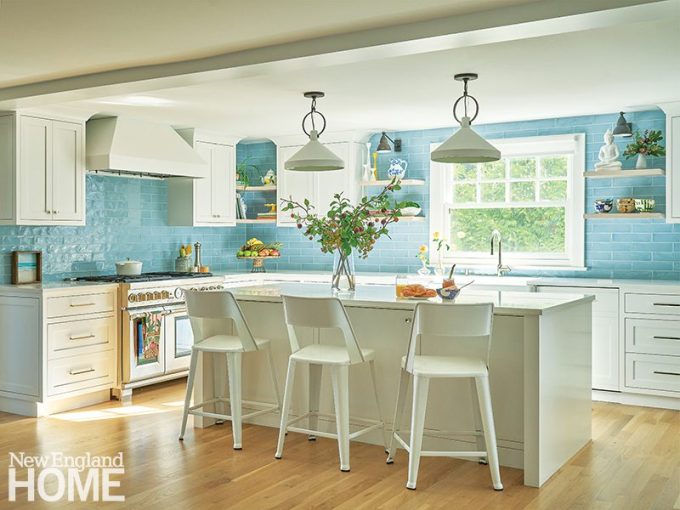 Moss Design_01 White kitchen with light blue backsplash and white pendant lights