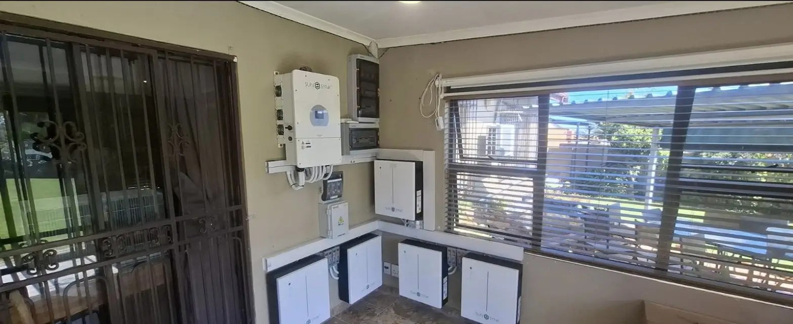 A Sunsynk inverter and battery bank installed on a wall by The Flash Electrical