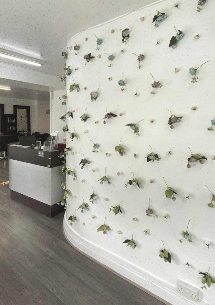 Neo-Derm Manchester Clinic, entrance, reception, flower wall