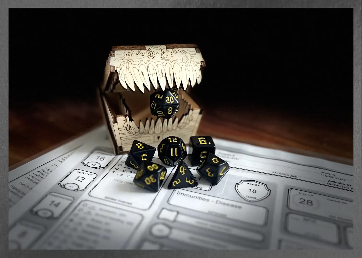 flat black polyhedral dice with yellow numbering sits on a character sheet while a mimic eats the D20