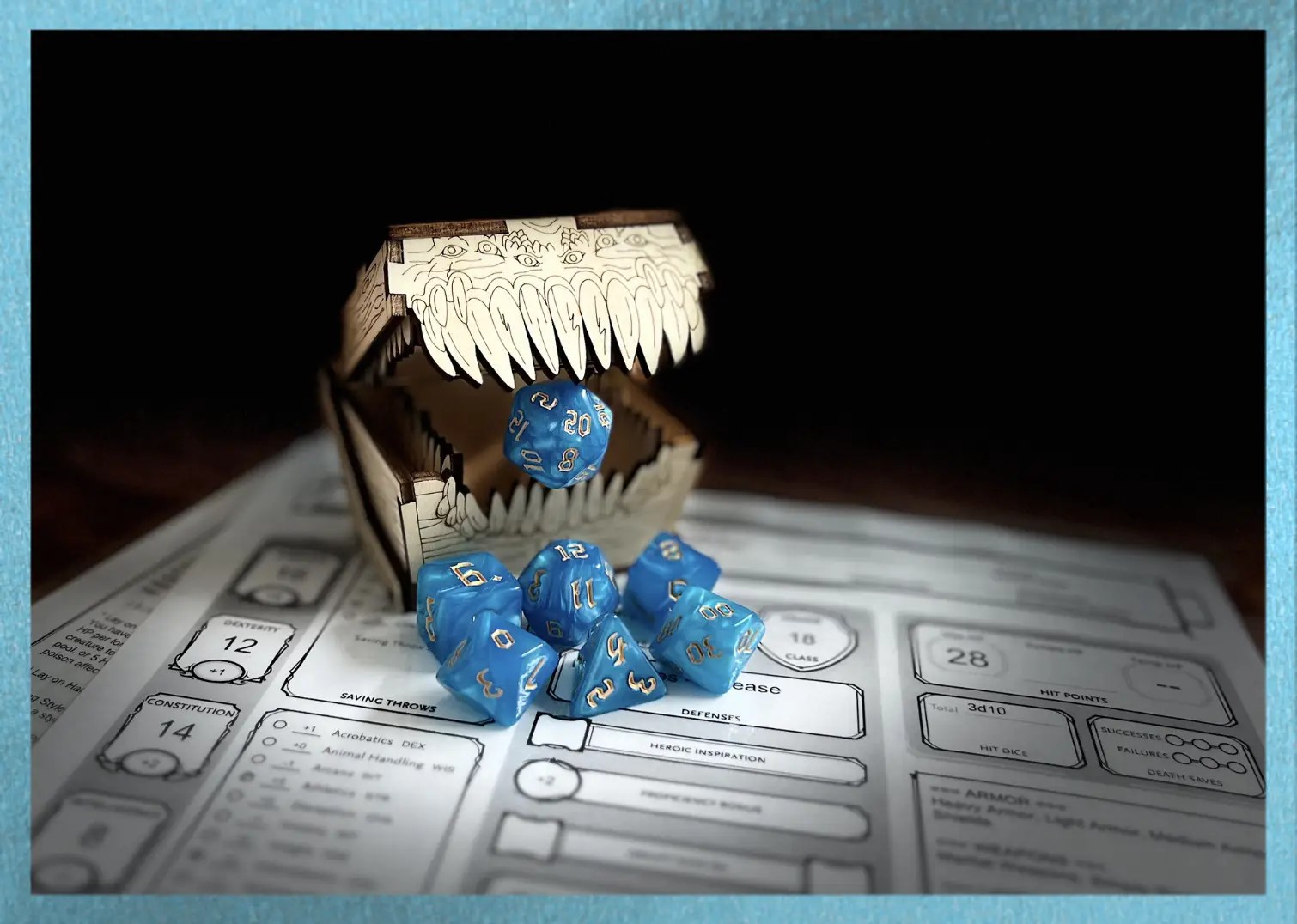 ocean blue swirl polyhedral dice with gold numbering sits on a character sheet while a mimic eats the D20