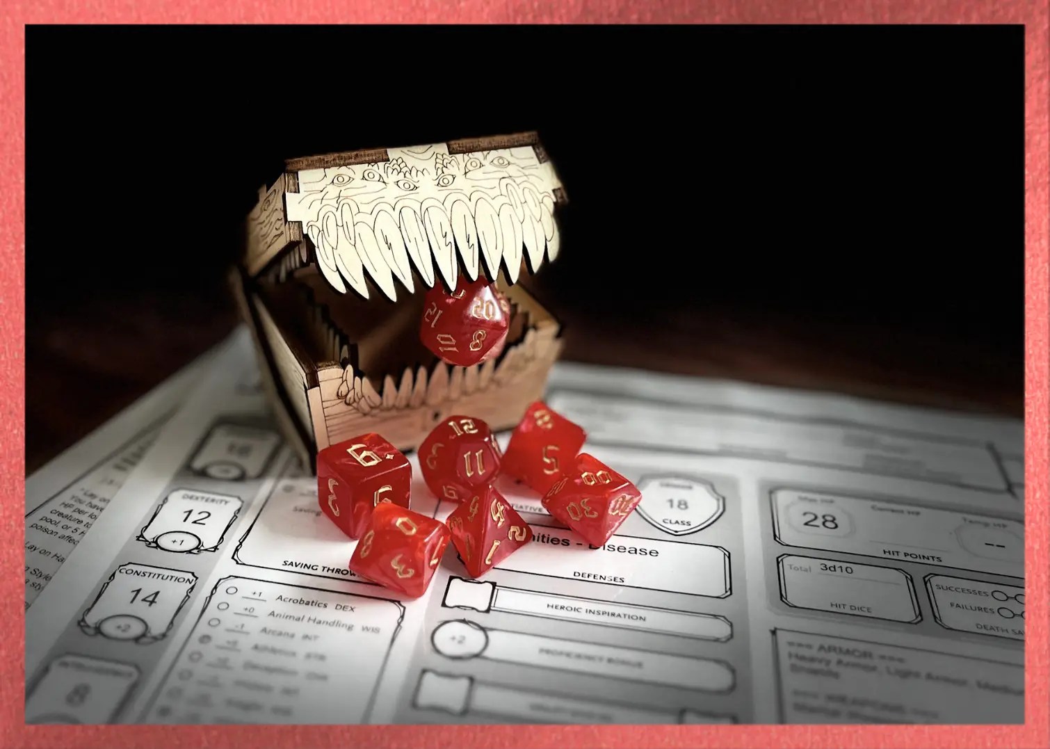 red swirl polyhedral dice with gold numbering sits on a character sheet while a mimic eats the D20