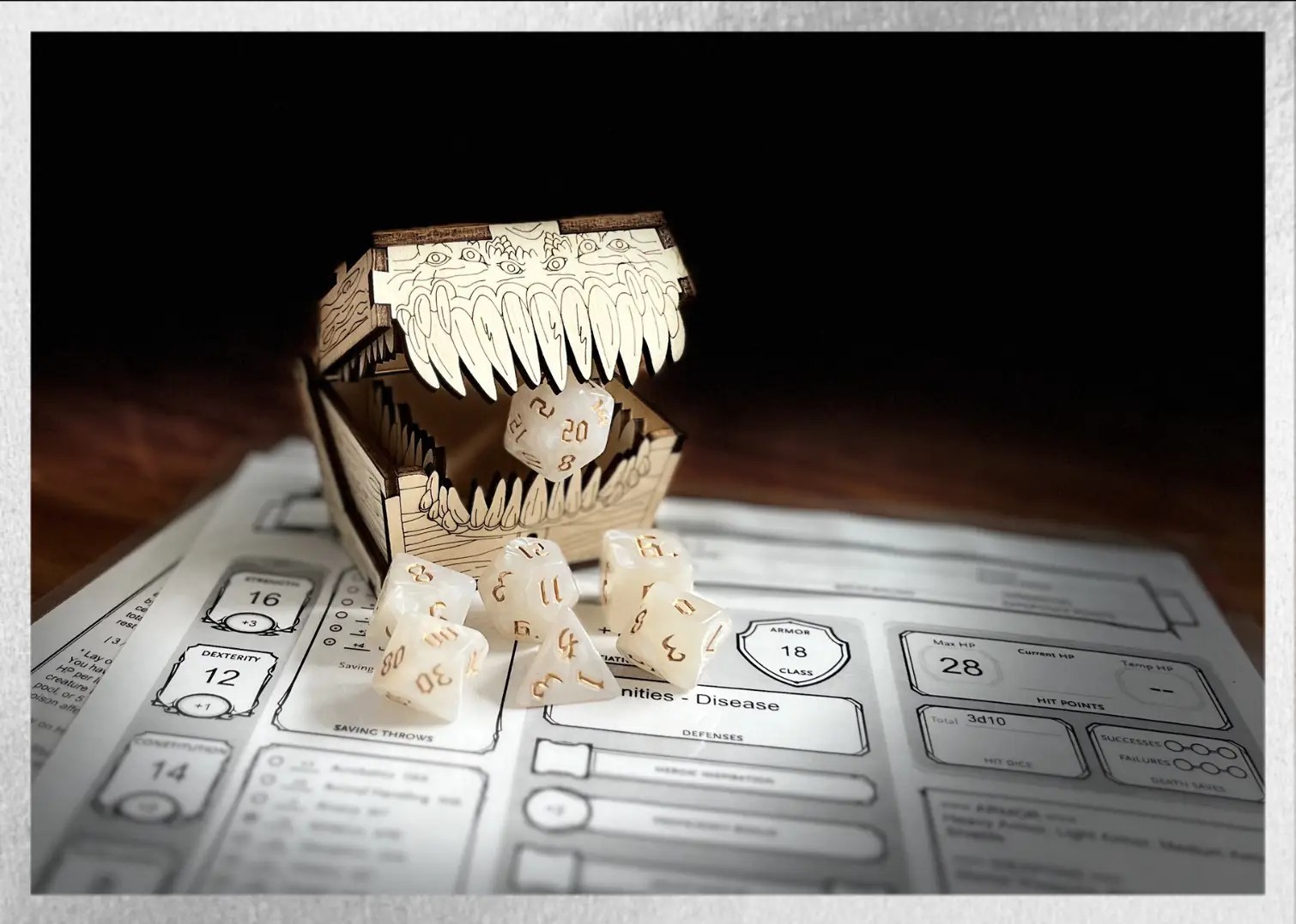 white swirl polyhedral dice with gold numbering sitting on a character sheet while a mimic eats the D20