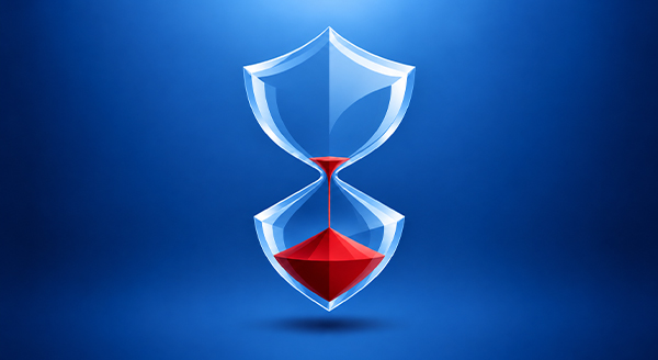 A glass hourglass shaped like a security shield on a blue background, with red sand almost run out into the bottom half