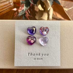 紫のキラキラハートピアス