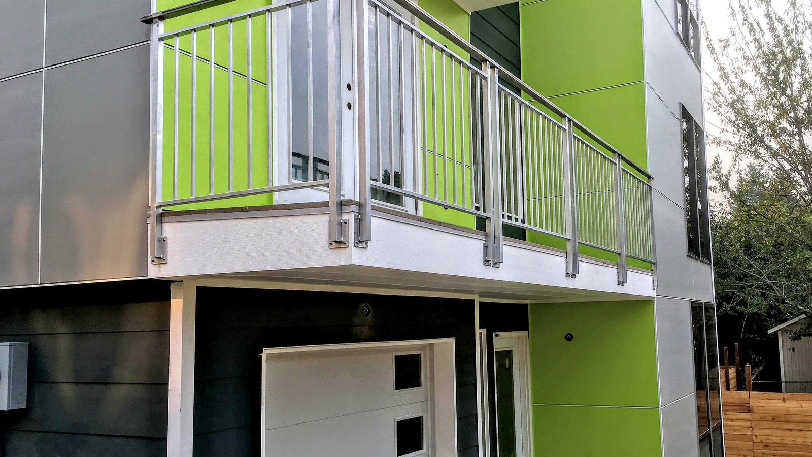 Custom aluminum balcony railing fabricated and installed on a modern residential home in Burnaby