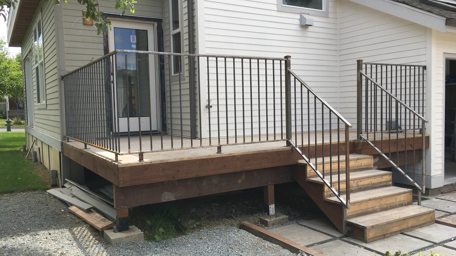 Custom steel deck railing and stair railing fabricated and installed for a residential home in Coquitlam