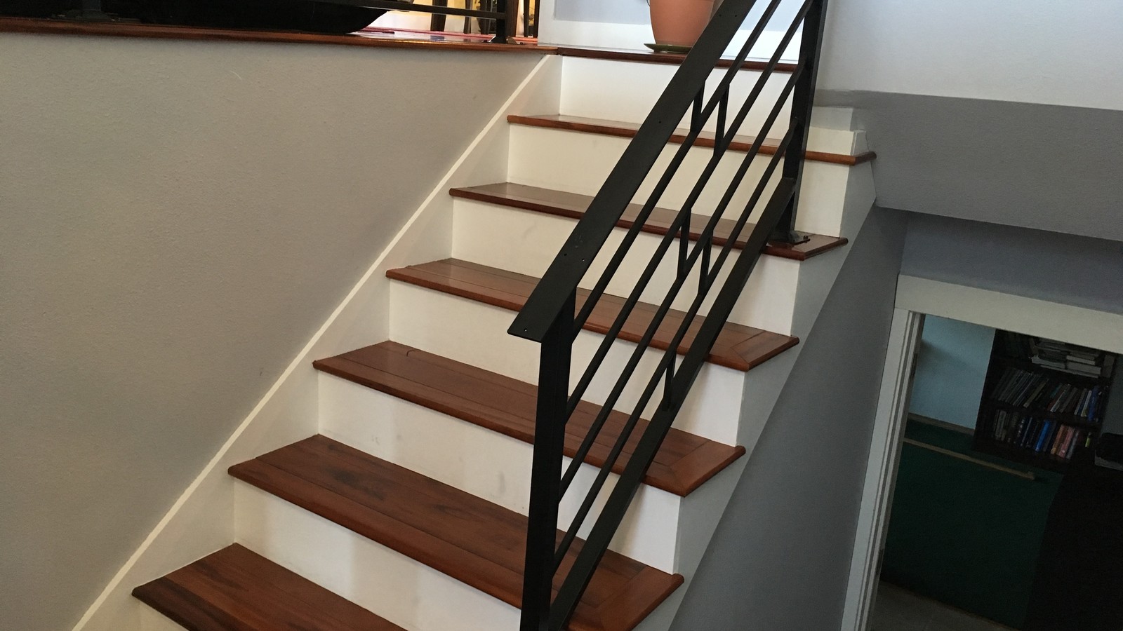 Modern black steel stair railing custom fabricated and installed in a residential home in Burnaby, BC