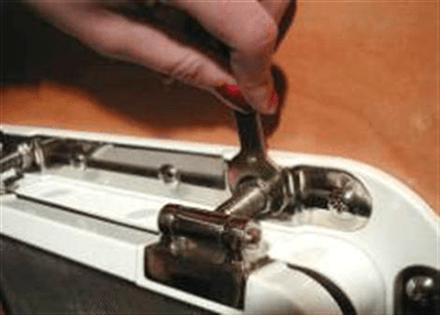 image of step 15a re-adjusting top hinges for pressure for Tri-Matrix portlight installation