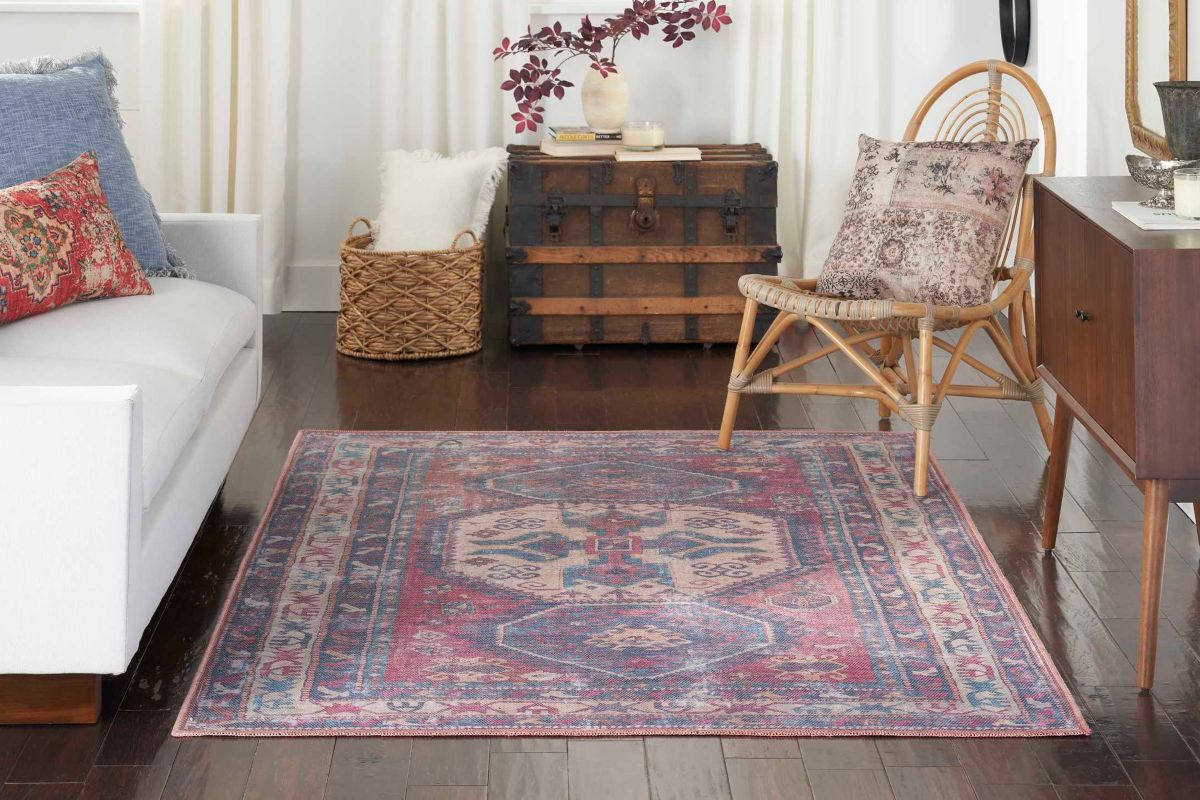 A synthetic rug made from polyester in a home office with other furniture.