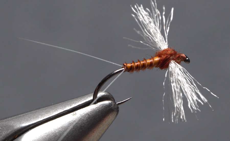 Poly Wing Rusty Sner Learn how to tie a mayfly spinner imitation which can be one of the most important insects to imitate while fly fishing. Poly Wing Rusty Sner This is part of a series of Tim Flaglers collaboration with Fly Tyer Magazine.