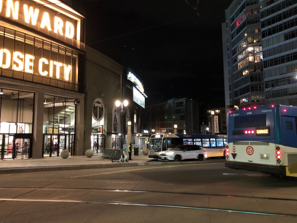 A TriMet bus outside Providence Park at night