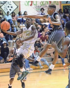 Toronco Loston of Capt Shreve shoots past Plain Dealing's Tyjuan Thomas for a layup. DOUGLAS COLLIER/THE TIMES