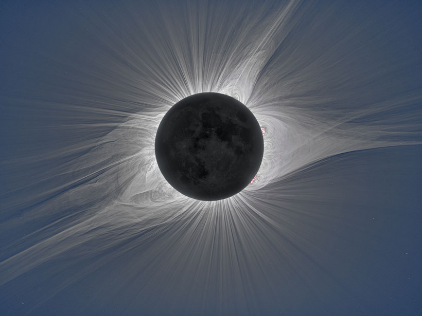Totality of a solar eclipse with craters of the Moon and the solar corona visible
