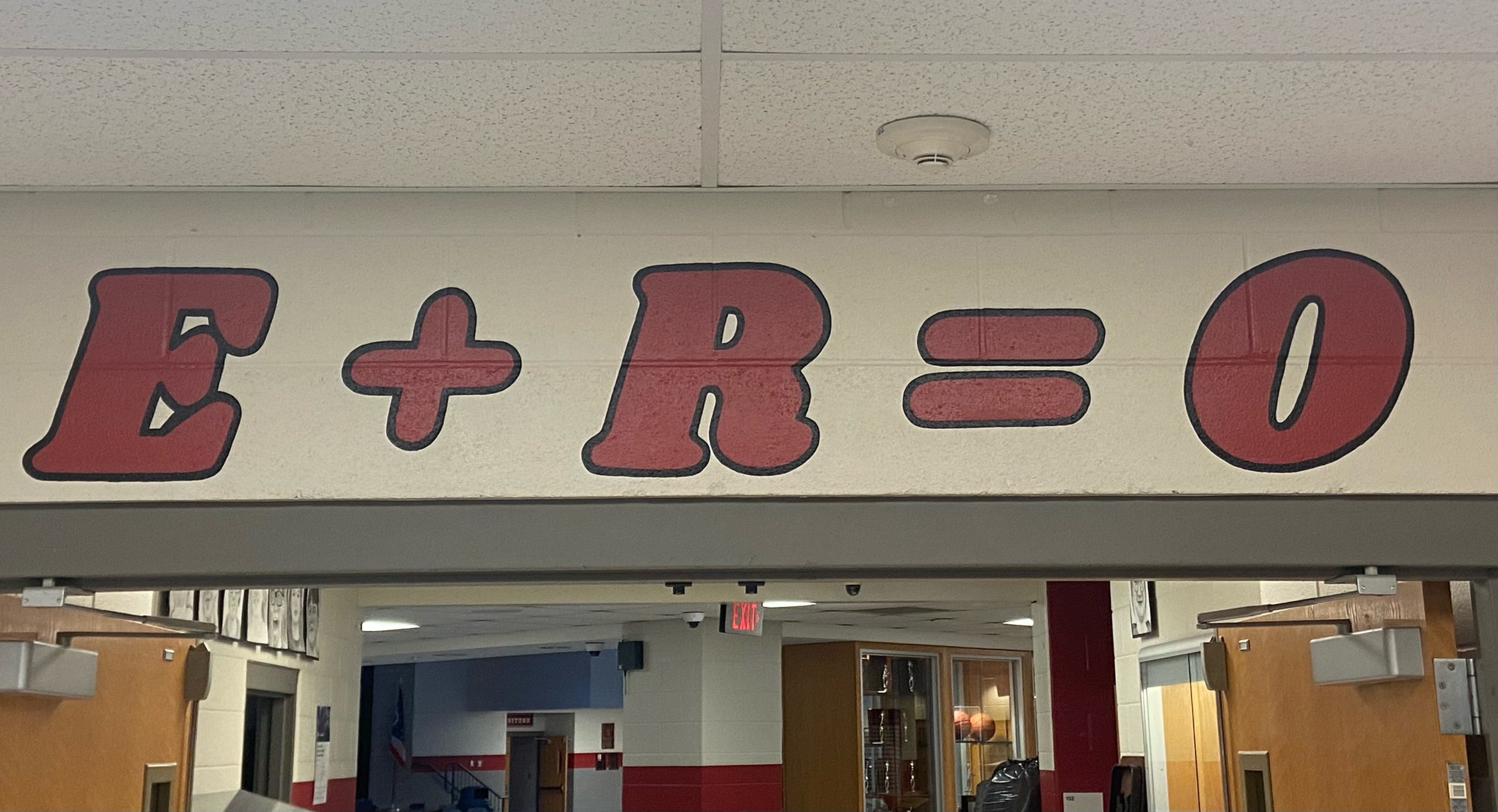 Red letters on a white wall